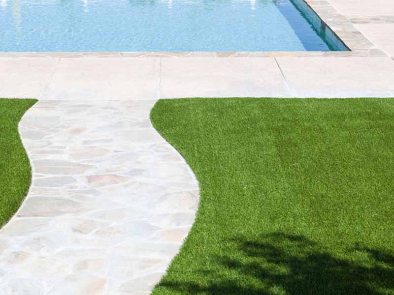 Artificial Grass Installed Near Walkway and Pool